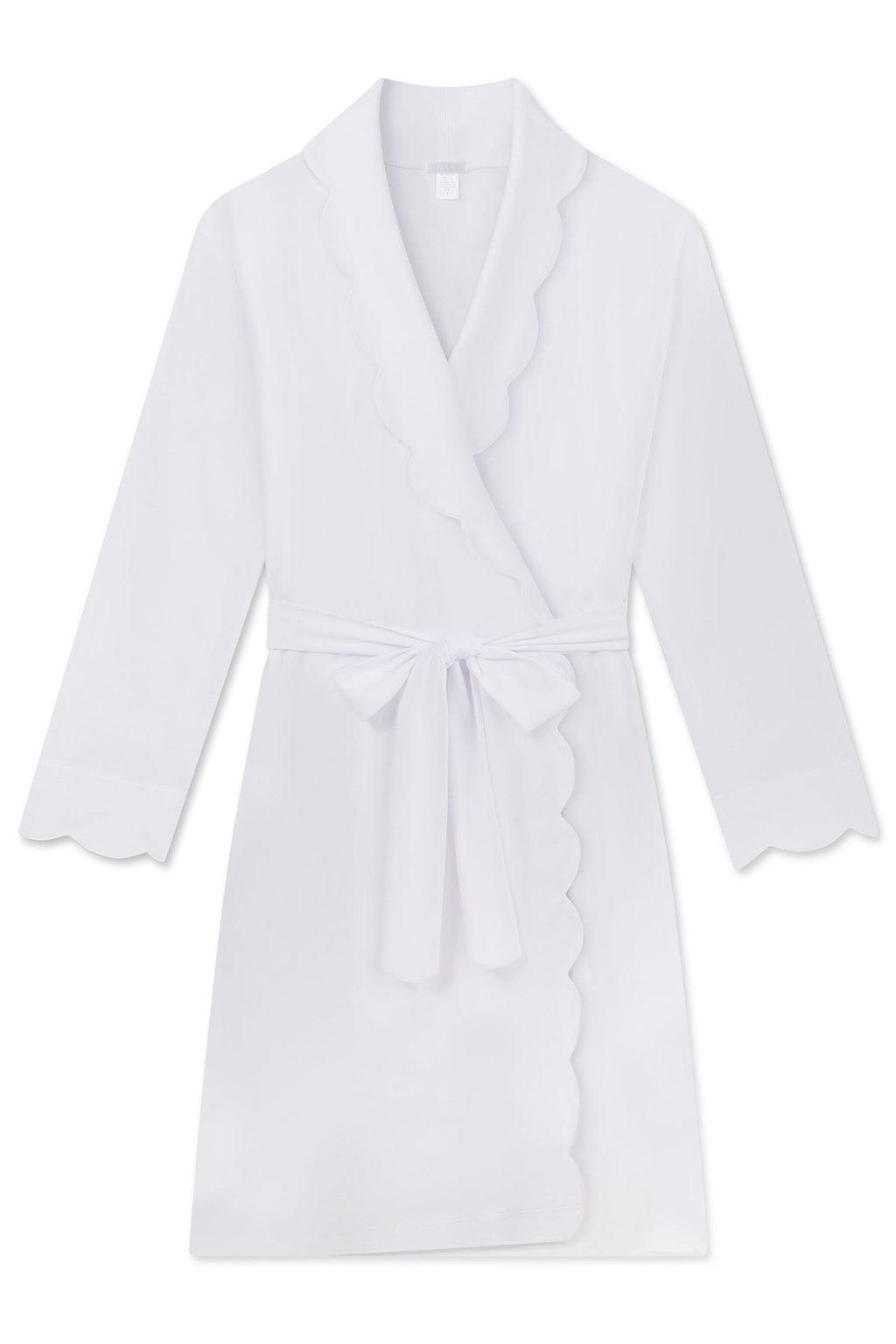 The Pima Scallop Robe in White is knee-length with long sleeves, featuring a scalloped lapel and edges on the collar, cuffs, and hem. Made from 100% luxuriously soft Pima cotton, it includes a matching tie belt at the waist, ideal for loungewear or post-bath relaxation.