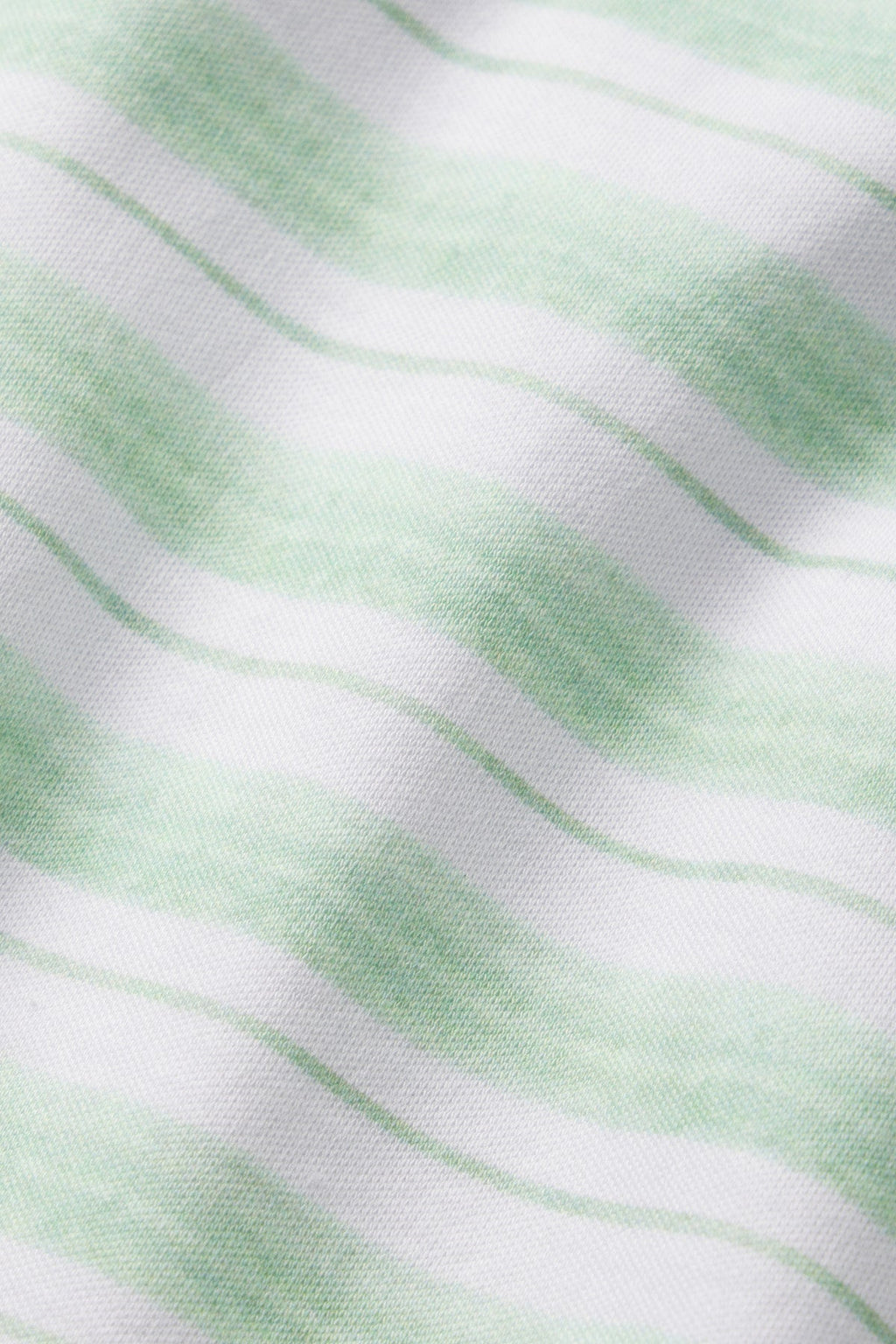 Close-up of the Kids Long-Long Set in Parisian Green Picnic Stripe, featuring wavy light green and white stripes on soft 100% Pima cotton fabric with gentle folds.